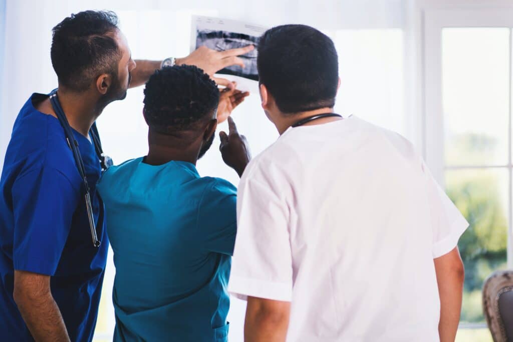 A diverse group of healthcare professionals providing comprehensive services in a modern medical office